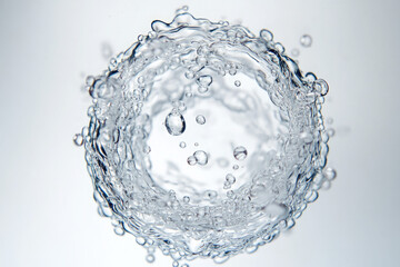 Wall Mural - A circle of water droplets with a white background