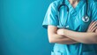 © Tati - Healthcare professional in scrubs with stethoscope on blue background