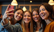 © mattegg - Four Women Sharing a Joyful Selfie Moment