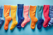 © Daniel - Abstract background with colorful socks for National Sock Day. Celebrate your love of socks, perfect for advertising, banners, and social media posts. Copy space available for your text.