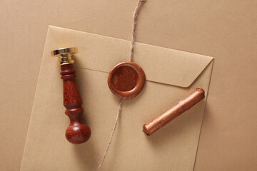 Sticker - Envelope with wax seals and vintage stamp, thread on beige background. DIY, Gift certificate, wedding invitation.