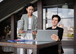 © Nassorn - Latino man and African American businessperson brainstorming startup small business strategy together. Young multiracial businesswoman and colleague serious working on planning. Diversity people team.
