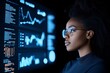 © Odin AI - A focused woman with glasses studies complex data visualizations and graphs on a large digital screen, highlighting analytical thinking and data-driven decision-making.