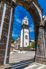 Wall Mural - A view through  the City Gates towards Main Church of San Sebastian in Ponta Delgada on the island of Sao Miguel in the Azores in summertime