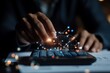 © Odin AI - A hand manipulates a calculator with abstract digital sparks connecting, exhibiting themes of modern technology, innovation, and data calculation.