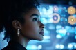 © Odin AI - Profile of a woman with an intricate hairstyle, looking intently at a blue-lit digital interface filled with graphs and circular data elements.