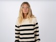 © Jihan - Shot of pleasant looking caucasian teen girl wearing striped knitted sweater over white , pouts lips, looks at camera, Human facial expressions
