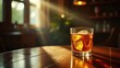 © realone952 - A clear glass of alcohol on the wooden table at home in the morning