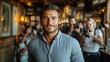 © Anna - Confident man posing in trendy cafÃ© setting surrounded by photographers