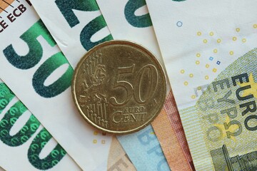 European currency euro cent coin lies on euro banknote bill