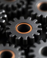Poster - A close-up view of interlocking gears with a black and orange design, symbolizing machinery and mechanical engineering.