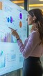 © Maria Mikhaylichenko - Professional analyzing data on large interactive screen, pointing to colorful charts and graphs. Modern office setting showcases cutting-edge technology in action.