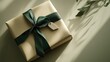 © Timeless Touch - Minimalist Christmas wrapping with a single green ribbon and handmade clay tag, placed on a neutral background.