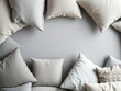 © PuriStudio - Assortment of stylish cushions in shades of grey on a textured background, design, assortment