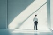 © masud - Man Standing in a Minimalist Office Space, Contemplating the Future