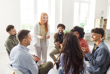 Business people team participates in a group meeting, sitting in a circle in the office. Team engages in conversation and collaboration, working together in a professional and teamwork environment.