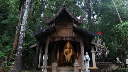 Wall Mural - Nature video background of the atmosphere inside the religious tourist attraction in the middle of nature Meditation Point of Pha Lat Fall, the way up to Doi Suthep, Chiang Mai, travelers always stop 