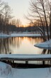 © LoFi J. - Winter landscape with a serene pond and wooden pier at sunrise.