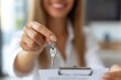© useful pictures - Close up focus on keys, smiling woman realtor selling apartment, offering to client, showing at camera, holding documents, contract, making purchasing deal, real estate agent, mortgage or rent