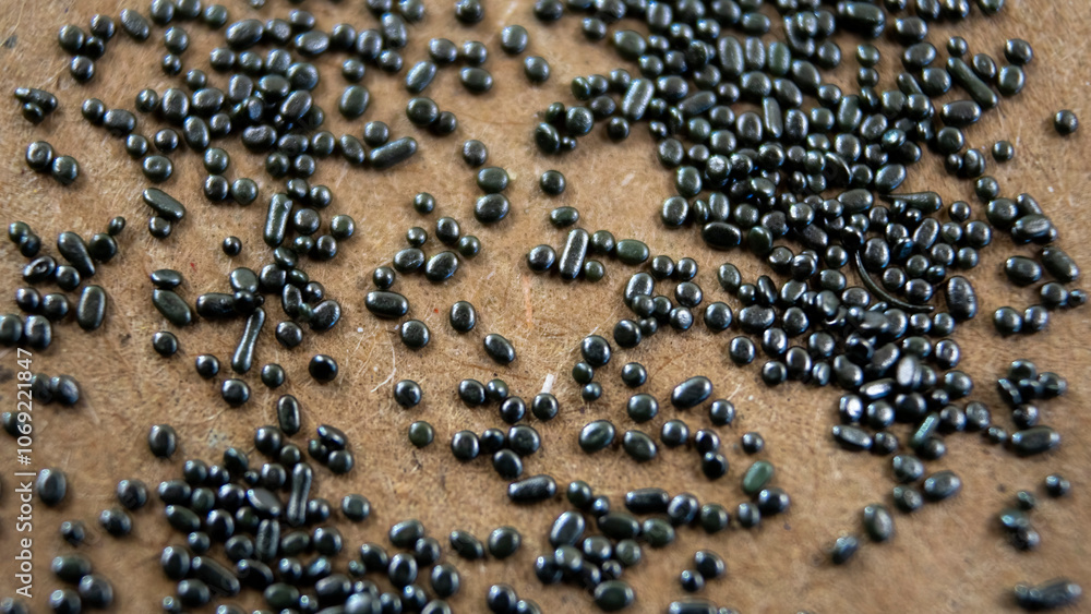 Gun Powder Flake Black smokeless gunpowder: Small silver spheroidal powder grains with a ...