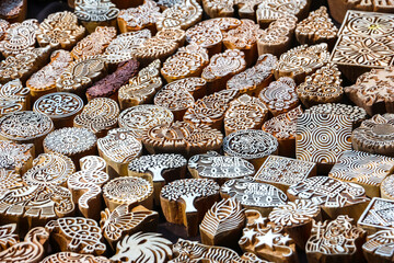 Wooden stamps printing blocks hand carved by artisans on the street market in Arambol, Goa, India. Henna stamps for decorating the body or clothes.