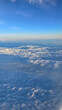 © Marc Kunze - Beautiful aerial view from the airplane with clouds and blue sky