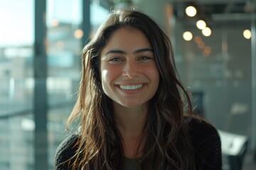 Wall Mural - A smiling woman with long brown hair posing for a photo