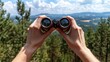 © Konstiantyn Zap - Exploring nature through binoculars in a scenic forest landscape