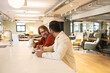 © ADDICTIVE STOCK - Collaborative discussions in a modern coworking space