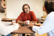 © ADDICTIVE STOCK - Team Collaboration and Coffee in a Modern Coworking Space