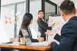 © PRIME STOCK LAB - businesswoman presents data to colleagues in modern office setting, showcasing charts and graphs. team engages in discussion, highlighting collaboration and professionalism