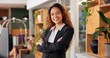 © peopleimages.com - Receptionist, arms crossed and portrait of woman at hotel for hospitality, luxury and check in. Information, lobby and concierge with person at resort for consultant, assistance and reservation