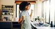 © S Fanti/peopleimages.com - Dance, smoothie and music with woman in kitchen for health, breakfast and nutrition diet. Streaming service, podcast and green juice with person listening to headphones in home for morning routine