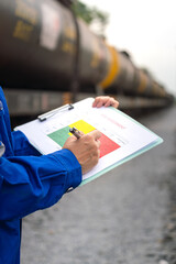 Wall Mural - a project engineer is writing on risk assessment matrix with different color that represent as risk 