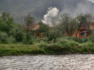 Wall Mural - Tourist recreation camp on the bank of the Ursul River early in the morning.