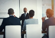 © peopleimages.com - Presentation, statistics and projection screen with CEO man in office boardroom for coaching or meeting. Finance, graph and report with business manager in corporate workplace for training or update