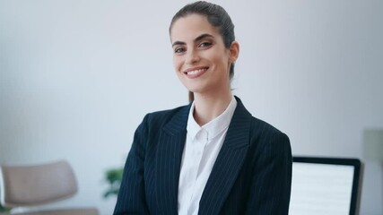 Wall Mural - Video of beauty business woman using her digital tablet while sitting on a desk in a modern startup office