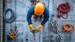 © DREAMERLYN STUDIO - High-angle view of a climber construction worker securing equipment on a building site, showcasing essential safety practices and attention to detail.
