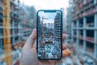 © Anurak - Construction Site Viewed Through Smartphone.