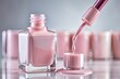 © Autun - A close-up shot captures pastel pink nail polish gracefully pouring from a brush into a bottle, showcasing the smooth, shimmering texture in exquisite detail.