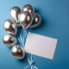 Wall Mural - Silver balloons with blank card on blue background. Flat lay, top view