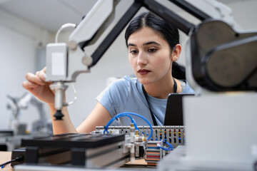 Wall Mural - hispanic engineer woman working on ai technology in robotics electronics engineering laboratory. uni