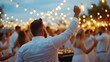 © Archil - Guests revel in lively dance moves under twinkling lights, embodying the joyous spirit of a vibrant wedding celebration.
