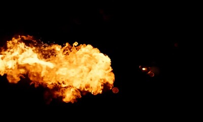 Meteor-like flaming object exploding dramatically on black background