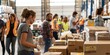 © 海翰 章 - A hive of activity: Volunteers hard at work distributing essential supplies to those in need.Concept of charity, humanitarian aid, food security, community service, volunteerism.