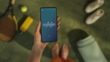 Poster - A Hand Holds a Smartphone Displaying an AI Chatbot Interface. Device Shows Tennis Rules, AI Assistants Provides Search Result Sports Information and Enhance User Knowledge On-demand. POV on Court Shot
