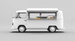 © Bambalino Studio - A white van with a food truck on top. The van is parked on a grey surface. Empty space for logo or text, mockup