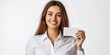 © HN Works - Attractive businesswoman presenting a blank credit card against a white background.