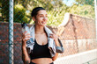 © peopleimages.com - Bottle, smile and thinking with sports woman on basketball court of exercise or fitness in summer. Break, idea and water with happy athlete person outdoor for challenge, competition or performance