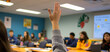 © Jari.art - student raises hand in classroom, eager to participate in discussion. environment is focused and collaborative, with peers engaged in learning